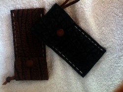 black and brown leather pouches.
